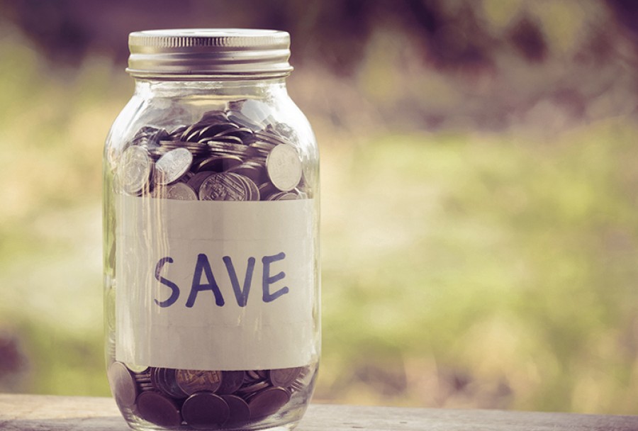 Savings jar containing silver coins