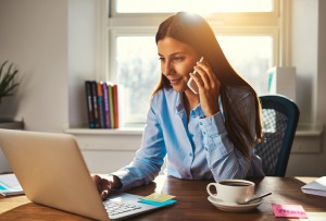 Woman on her computer inquiring about taxes