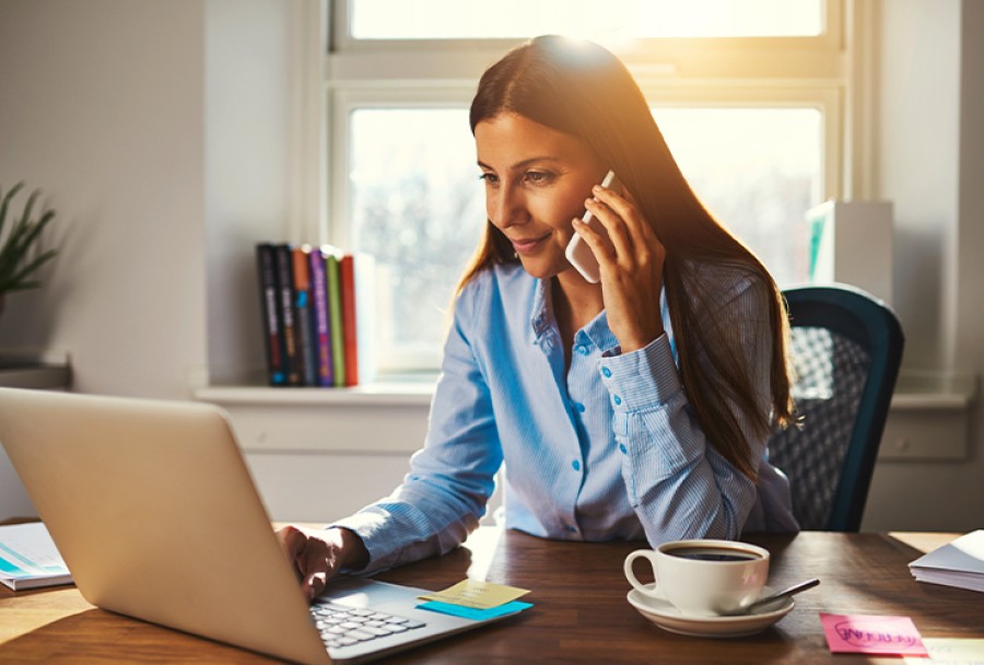 Woman on her computer inquiring about taxes